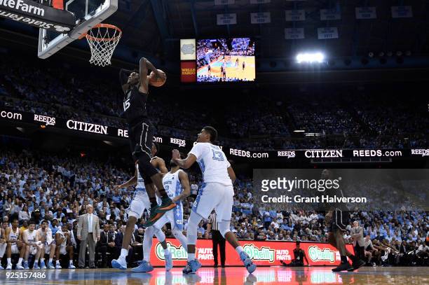Ebuka Izundu of the Miami Hurricanes dubks against the North Carolina Tar Heels during their game at the Dean Smith Center on February 27, 2018 in...
