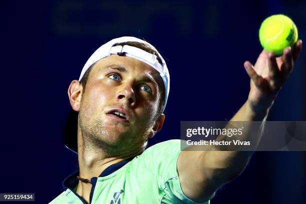 Radu Albot of Moldova serves during the match between Radu Albot of Moldova and Kevin Anderson of South Africa as part of the Telcel Mexican Open...