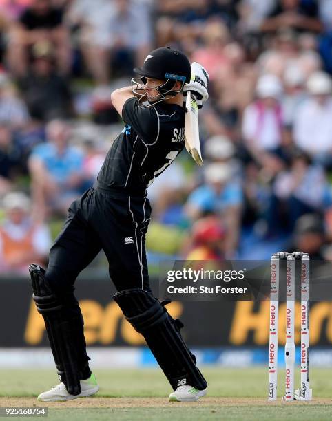 New Zealand batsman Mitchell Santner hits out during the 2nd ODI between New Zealand and England at Bay Oval on February 28, 2018 in Tauranga, New...