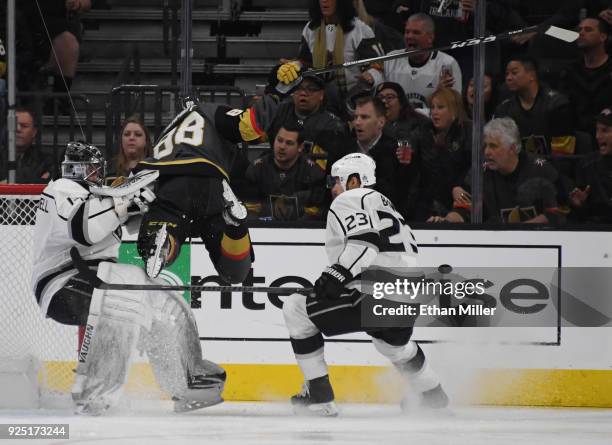 Nate Schmidt of the Vegas Golden Knights crashes into Jack Campbell of the Los Angeles Kings as Dustin Brown of the Kings looks on in the first...