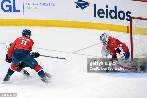 Washington Capitals goaltender Philipp Grubauer makes a third period save on shot by Ottawa Senators left wing Mike Hoffman who is held by defenseman...