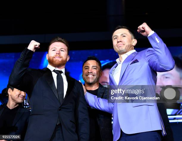 Boxers Canelo Alvarez boxing promoter and former professional boxer Oscar De La Hoya and Gennady Golovkin pose during a news conference at Microsoft...