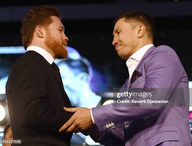 Boxers Canelo Alvarez and Gennady Golovkin shake hands during a news conference at Microsoft Theater at L.A. Live to announce their upcoming rematch...