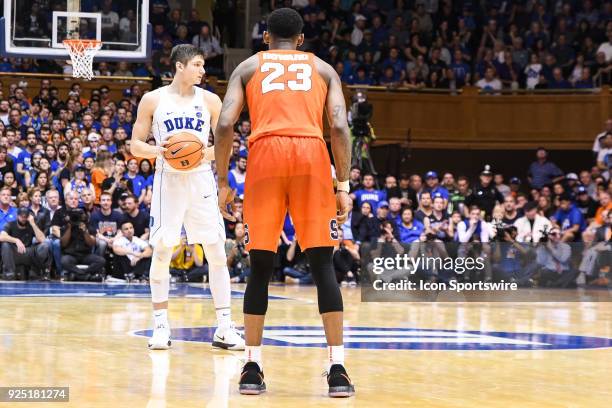 Duke Blue Devils guard Grayson Allen sets up the play as Syracuse Orange guard Frank Howard defends during the men's college basketball game between...