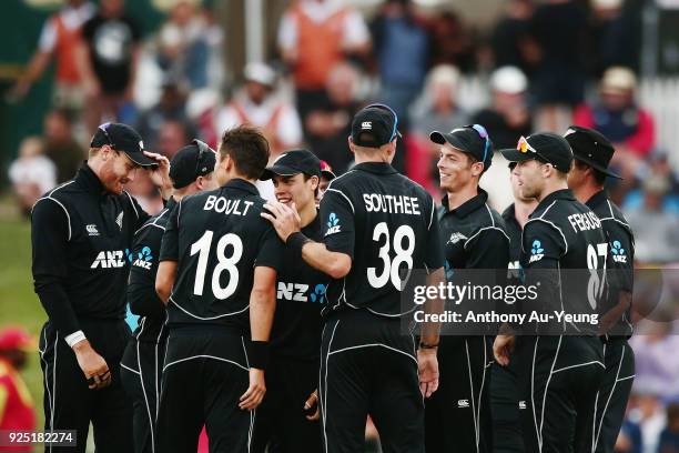 Mitchell Santner of New Zealand celebrates with teammates for the wicket of Jason Roy of England during game two of the One Day International series...