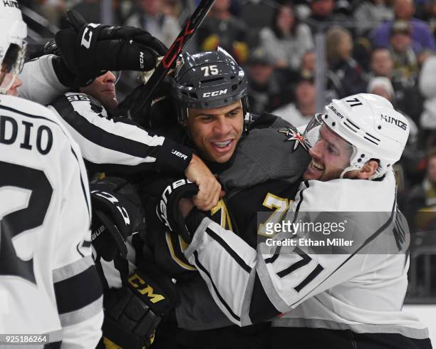 Ryan Reaves of the Vegas Golden Knights is grabbed by linesman Jonny Murray and Torrey Mitchell of the Los Angeles Kings during a scuffle in the...