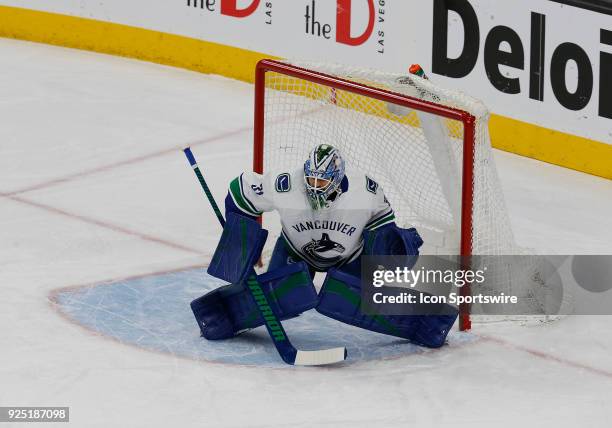 Vancouver Canucks goaltender Anders Nilsson tends the net during the first period of a regular season NHL game between the Vancouver Canucks and the...