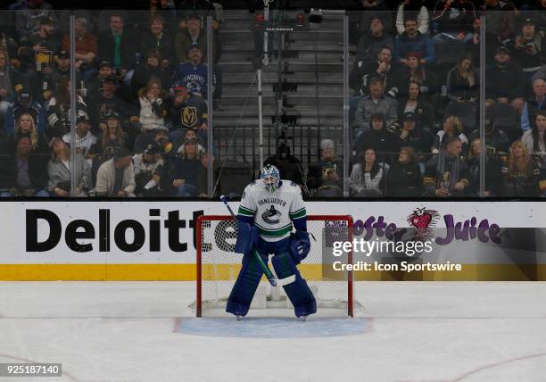 Vancouver Canucks goaltender Anders Nilsson tends the net during the first period of a regular season NHL game between the Vancouver Canucks and the...