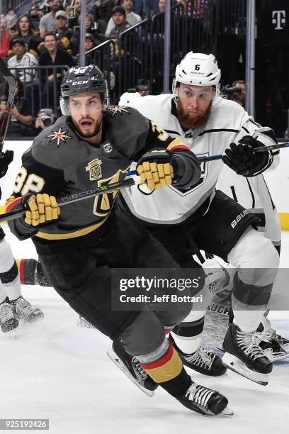 Tomas Hyka of the Vegas Golden Knights and Jake Muzzin of the Los Angeles Kings skate to the puck during the game at T-Mobile Arena on February 27,...