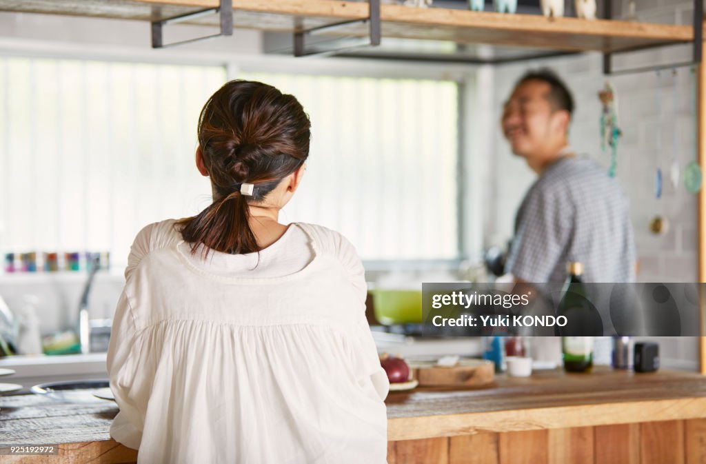 A woman waiting for her husband's dish to come up.
