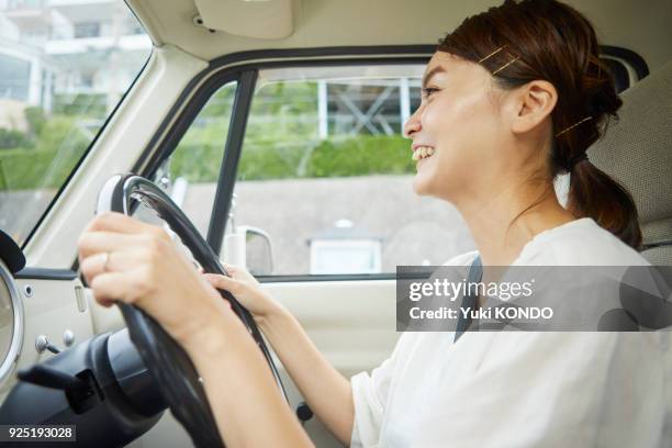 a couple in drive. - right hand drive stock pictures, royalty-free photos & images