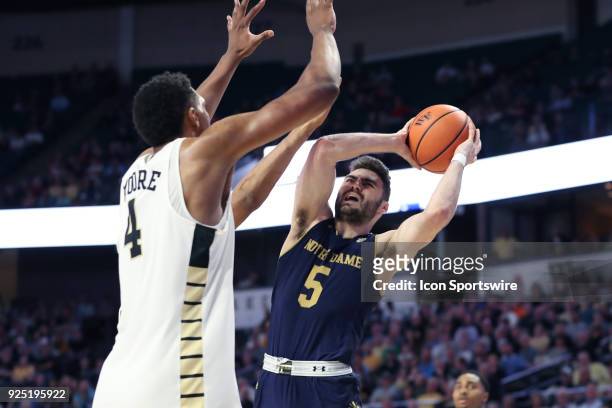 Notre Dame's Matt Farrell and Wake Forest's Doral Moore during the Wake Forest Demon Deacons game versus the Notre Dame Fighting Irish on February 24...