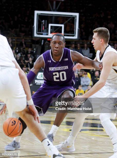 Guard Scottie Lindsey of the Northwestern Wildcatsgoes to the basket in the first half against guard Jordan Bohannon of the Iowa Hawkeyes, on...