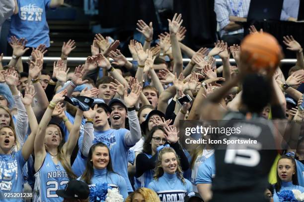 Students try to distract Miami's Ebuka Izundu while he shoots a free throw during the North Carolina Tar Heels game versus the Miami Hurricanes on...