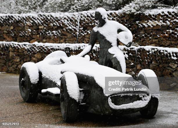 General view showing snow settled on the Juan Manuel Fangio memorial at the circuit during day three of F1 Winter Testing at Circuit de Catalunya on...