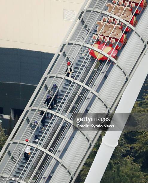 Photo taken from a Kyodo News helicopter shows passengers being guided off the Hollywood Dream - The Ride roller coaster at the Universal Studios...