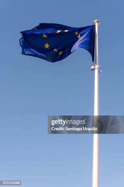 european union flag at berlaymont building - european union symbol stock pictures, royalty-free photos & images