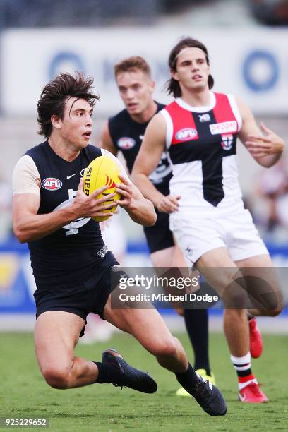 Caleb Marchbank of the Blues marks the ball during the JLT Community Series AFL match between the Carlton Blues and the St Kilda Saints at Ikon Park...