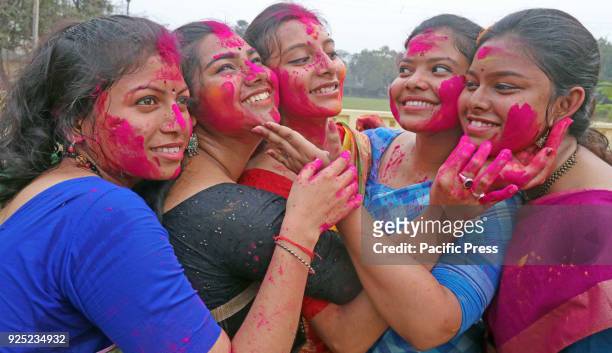 Students of Visva-Bharati University smear color powder onto each other during Basanta Utsav to welcome spring. The spring is the queen of all...