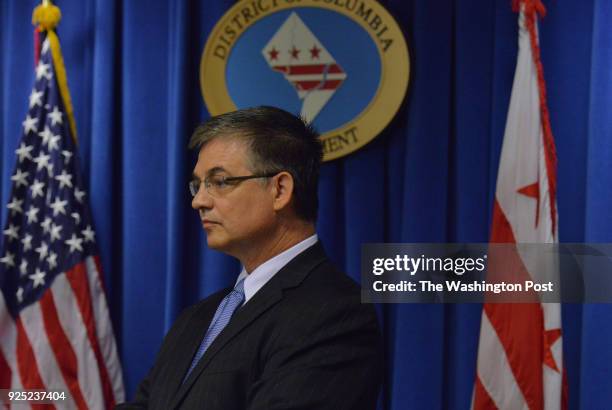 Washington, DC New DC Chief Financial Officer candidate, and likely choice, Jeffrey S DeWitt, listens to DC Mayor Vincent C. Gray during a press...