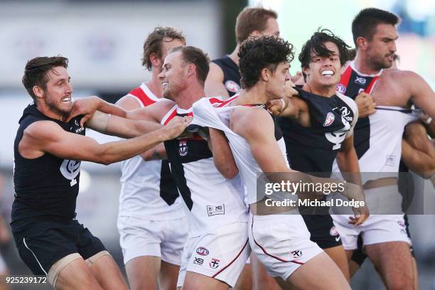 Dale Thomas of the Blues and David Armitage of the Saints wrestle in a melee after Jack Sinclair of the Saints was hit late by Kade Simpson of the...