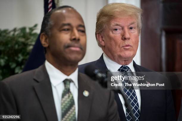 President Donald Trump listens as Secretary of Housing and Urban Development Ben Carson speaks during an event to honor Dr. Martin Luther King Jr.,...