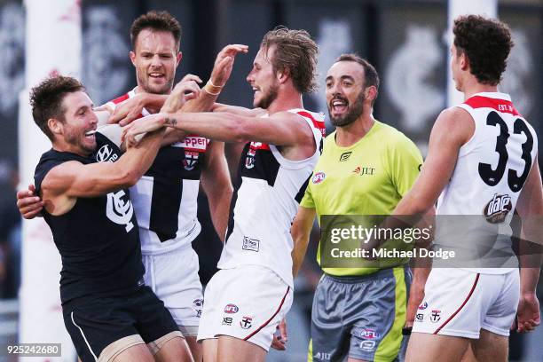 Dale Thomas of the Blues and Jimmy Webster of the Saints wrestle in a melee after Jack Sinclair of the Saints was hit late by Kade Simpson of the...