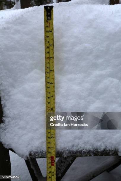 The tape measure shows nearly a foot of snow on February 28, 2018 in West Kyo, CoDurham, United Kingdom. Freezing weather conditions dubbed the...