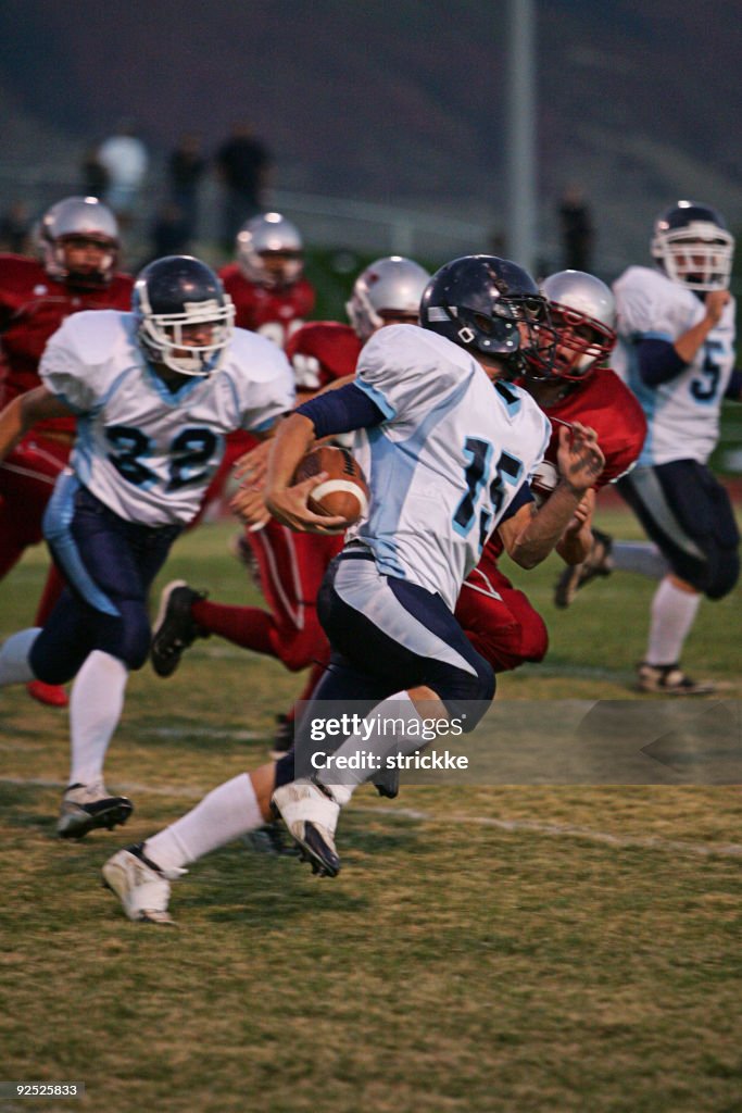 Football Running Back Runs Ball Around End