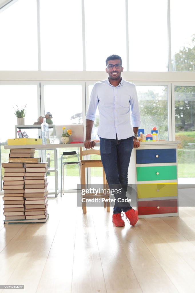 Young man stood in home office