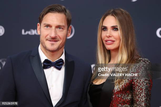 Former Italian football player Francesco Totti and his wife Italian TV host and model Ilary Blasi arrive for the 2018 Laureus World Sports Awards...