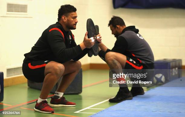 Nathan Hughes and Courtney Lawes stretch during the England conditioning session held at Nuffield Health Centre on February 28, 2018 in Oxford,...