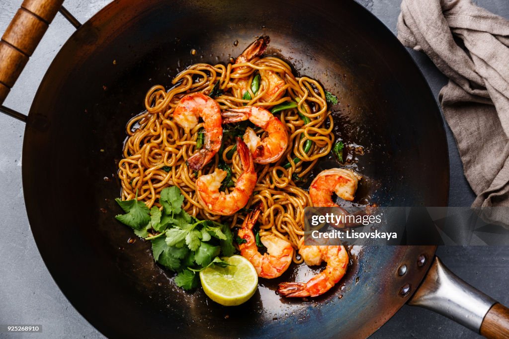 Ramen stir-fry noodles with shrimp in wok pan
