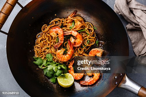 Ramen stir-fry noodles with shrimp in wok pan Ramen stir-fry noodles with shrimp in wok pan