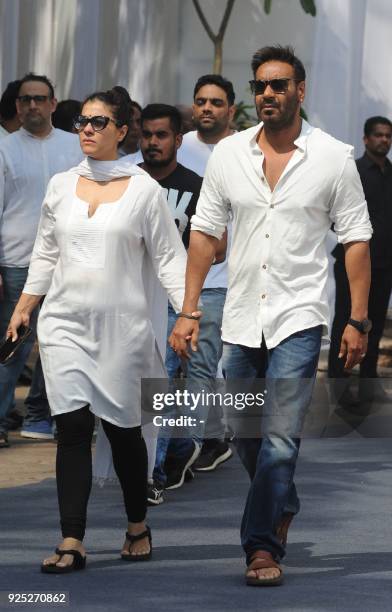 Indian Bollywood actors Kajol Devgn and Ajay Devgan attend the funeral of legendary late Bollywood actress Sridevi Kapoor in Mumbai on February 28,...
