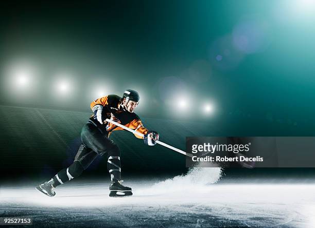 ice hockey player passing puck. - hockey su ghiaccio foto e immagini stock