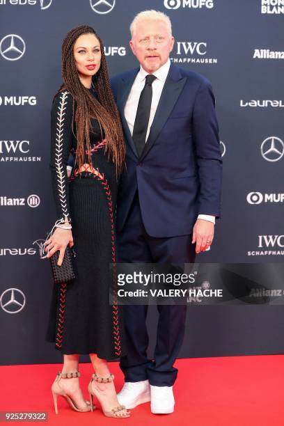 Former German tennis player Boris Becker and his wife Lilly Becker pose as they arrive for the 2018 Laureus World Sports Awards ceremony at the...