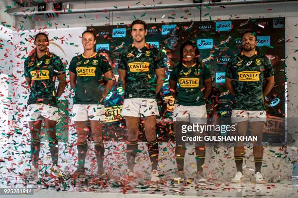 South Africa's National Springbok Sevens players Justin Geduld, Marithy Pienaar, Chris Dry, Zintle Mpupha and Rosko Specman pose in new uniforms...