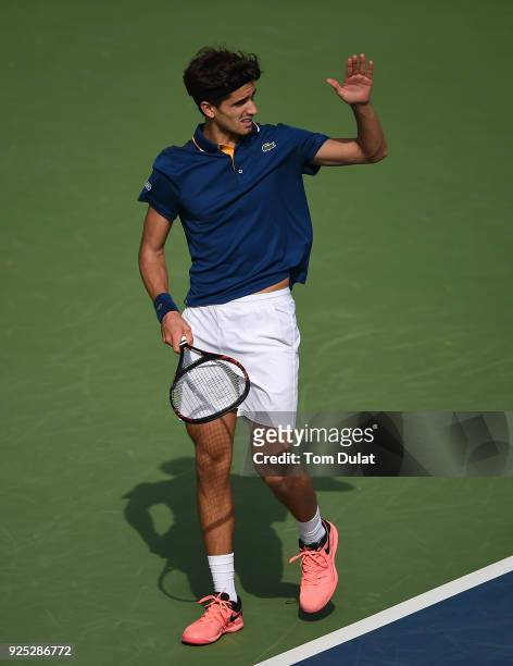 Pierre-Hugues Herbert of France reacts during his match against Roberto Bautista Agut of Spain on day three of the ATP Dubai Duty Free Tennis...