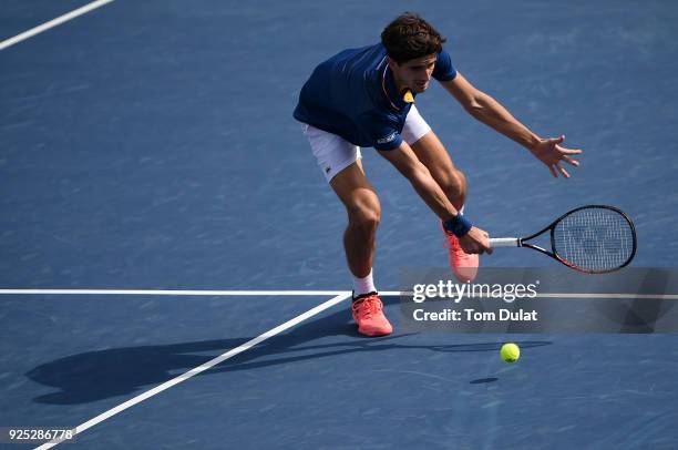 Pierre-Hugues Herbert of France in action during his match against Roberto Bautista Agut of Spain on day three of the ATP Dubai Duty Free Tennis...