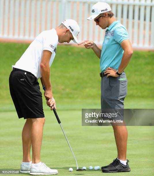 Matthias Schwab of Austria practices his putting with his caddie ahead of the Tshwane Open at Pretoria Country Club on February 28, 2018 in Pretoria,...