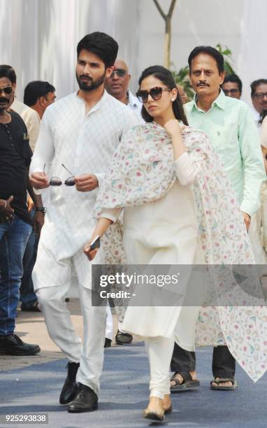 Indian Bollywood actor Shahid Kapoor attends with his wife Mira Rajput the funeral of legendary late Bollywood actress Sridevi Kapoor in Mumbai on...