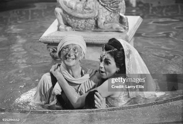 British actors Charles Hawtrey as 'Private James Widdle' and Carmen Dene on the set of comedy film 'Carry On Up the Khyber', UK, 9th May 1968.