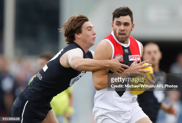 Paddy McCartin of the Saints and Caleb Marchbank of the Blues in action during the AFL 2018 JLT Community Series match between the Carlton Blues and...