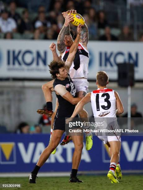 Tim Membrey of the Saints attempts to mark over Caleb Marchbank of the Blues during the AFL 2018 JLT Community Series match between the Carlton Blues...