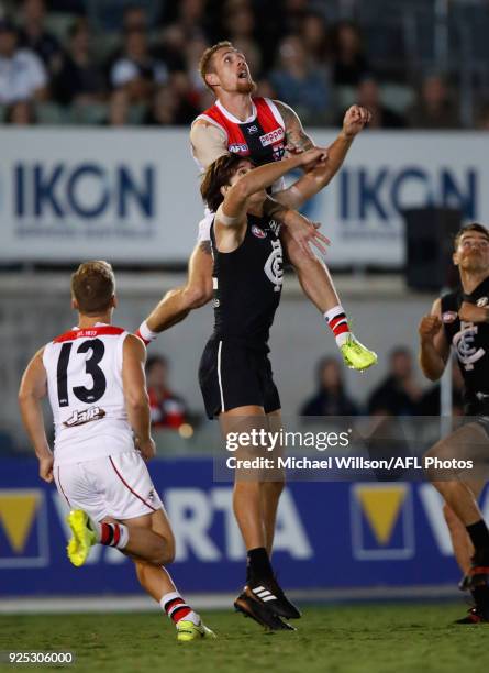 Tim Membrey of the Saints attempts to mark over Caleb Marchbank of the Blues during the AFL 2018 JLT Community Series match between the Carlton Blues...