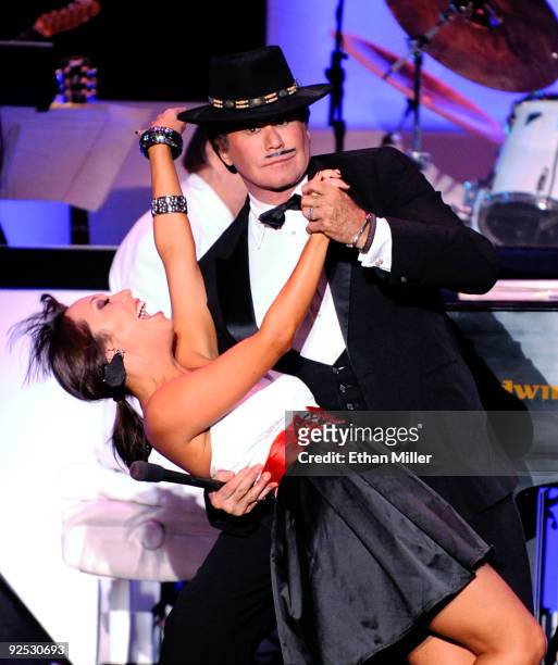 Wayne Newton and dancer Cheryl Burke perform during the ''Dancing With the Stars'' show during the opening night of his limited-engagement production...