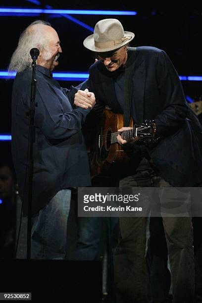 David Crosby of Crobsy, Stills and Nash with James Taylor perform onstage at the 25th Anniversary Rock & Roll Hall of Fame Concert at Madison Square...