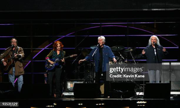 Bonnie Raitt with Stephen Stills, Graham Nash and David Crosby of Crosby, Stills and Nash perform onstage at the 25th Anniversary Rock & Roll Hall of...
