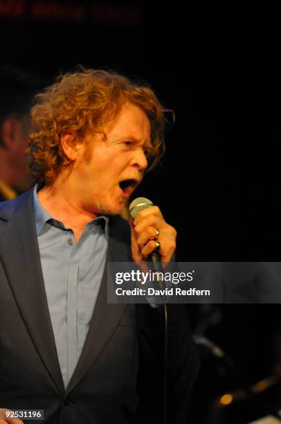 Mick Hucknall performs on stage with the Ronnie Scotts Big Band to celebrate 50 years of the legendary jazz club at Ronnie Scott's Jazz Club on...